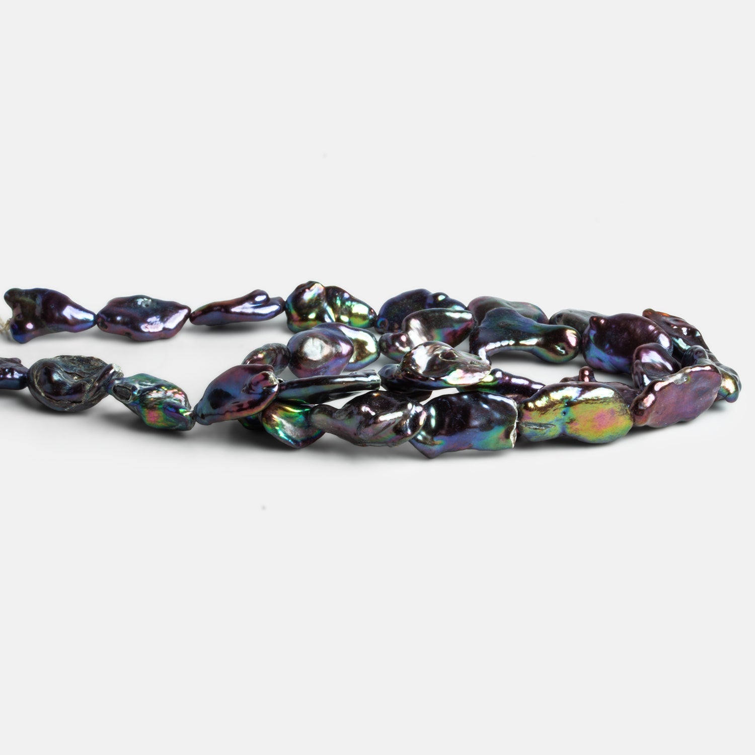 14x9mm Peacock Keshi Pearls 15 inch 24 beads - The Bead Traders