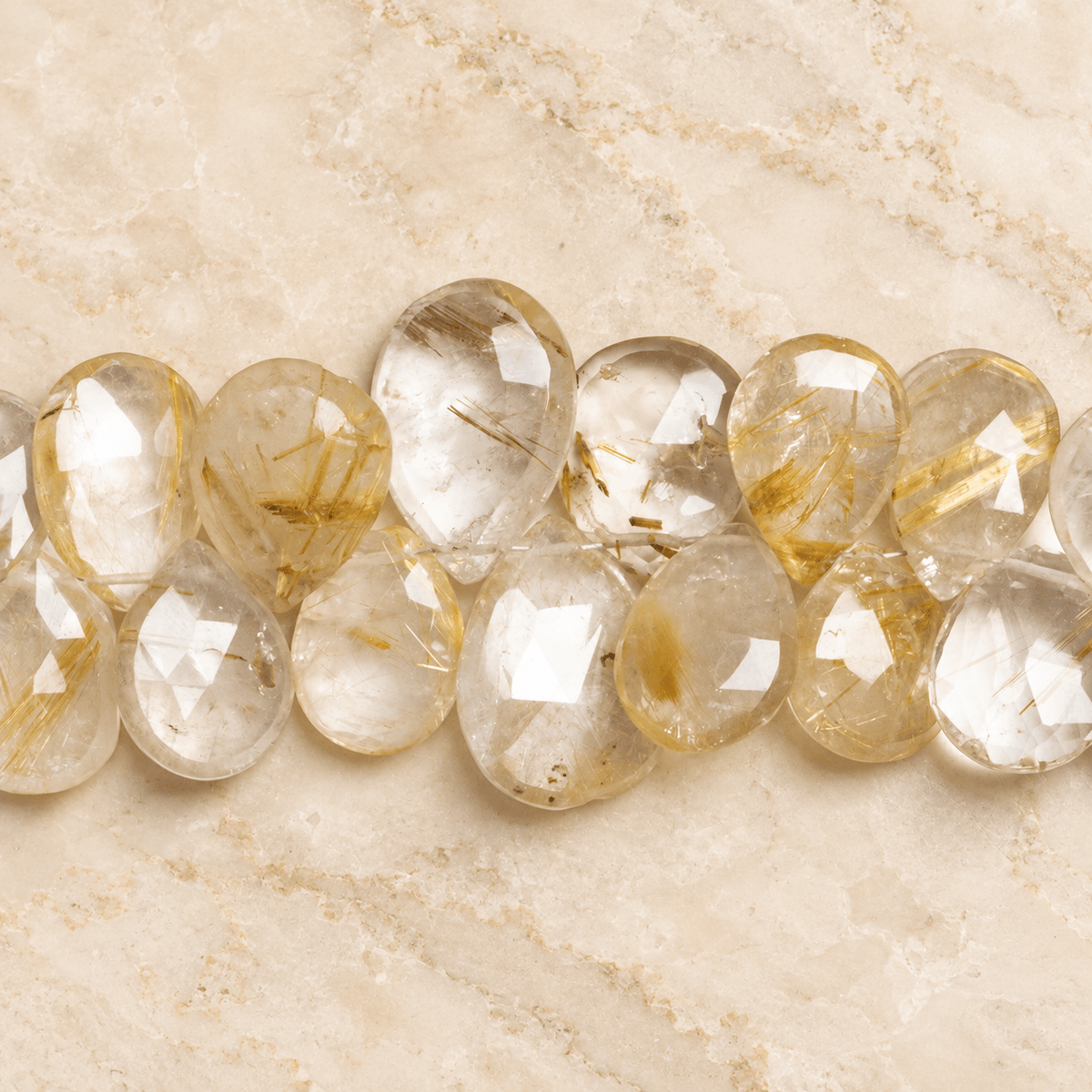 18x13mm Golden Rutilated Quartz Faceted Pears 7.5 inch 33 beads - The Bead Traders