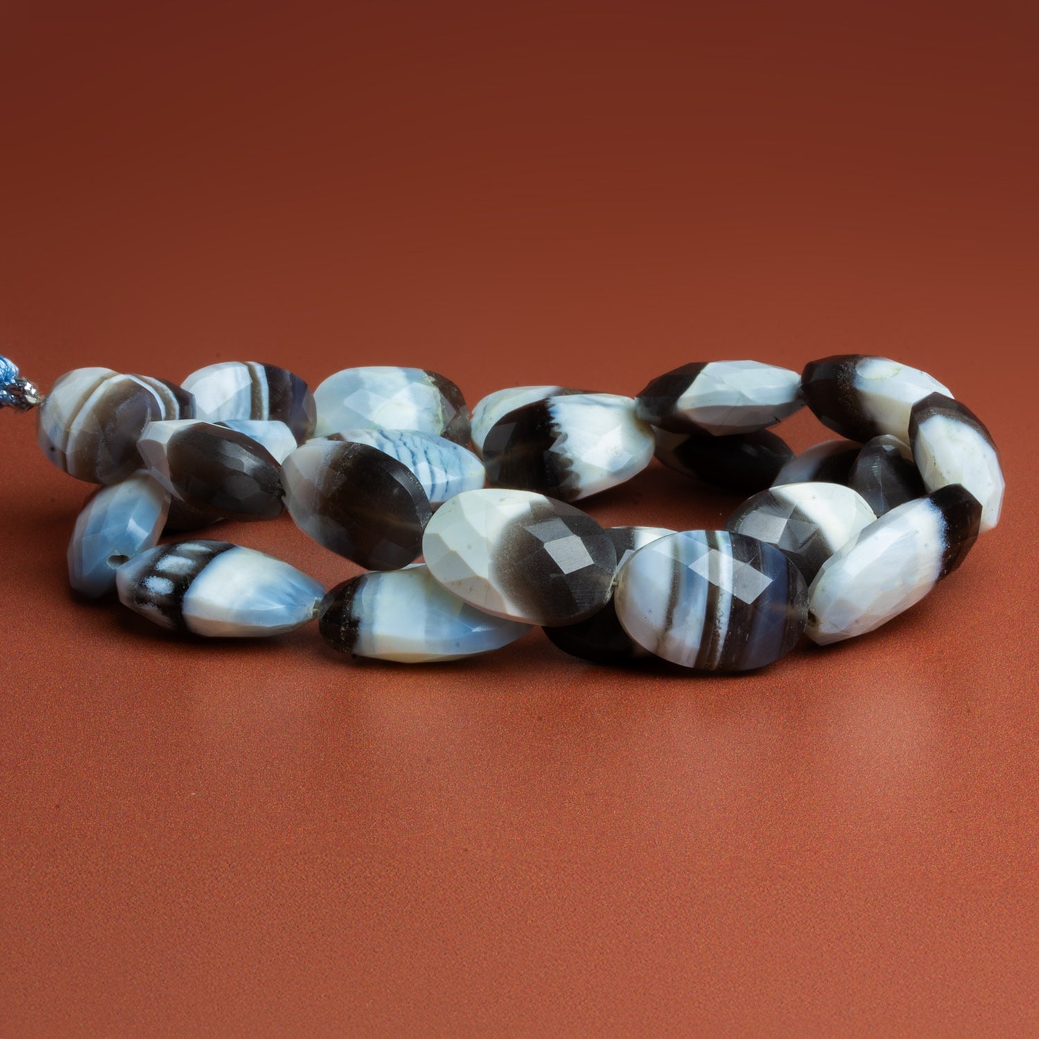 18x14mm Denim Opal Faceted Ovals 15 inch 19 beads - The Bead Traders