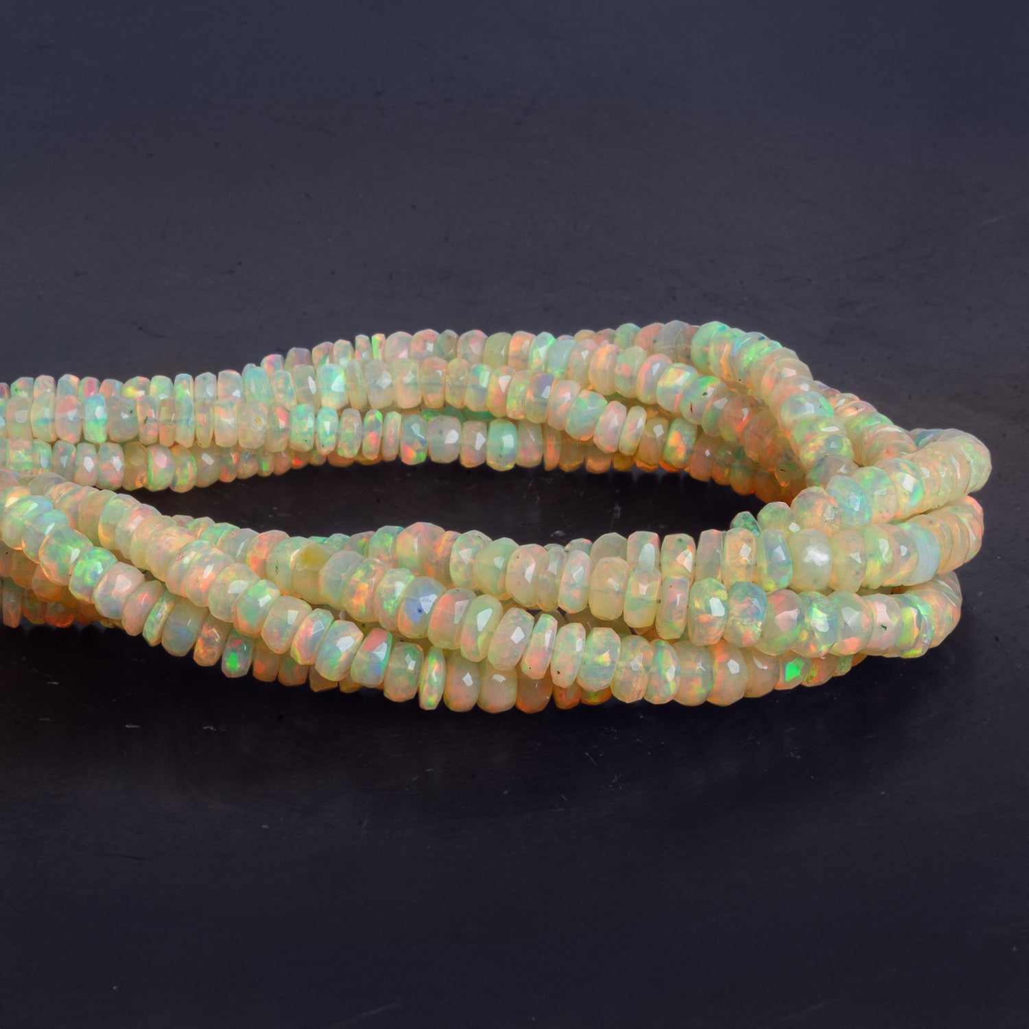 3.5 - 5.5mm Ethiopian Opal Faceted Rondelles 18 inch 180 beads - The Bead Traders