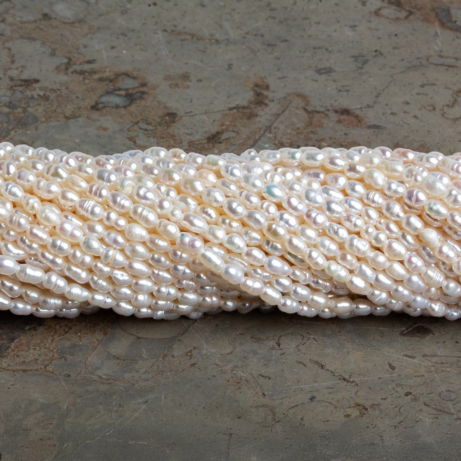 3x2mm Off White Baroque Rice Pearls 16 inch 95 beads - The Bead Traders