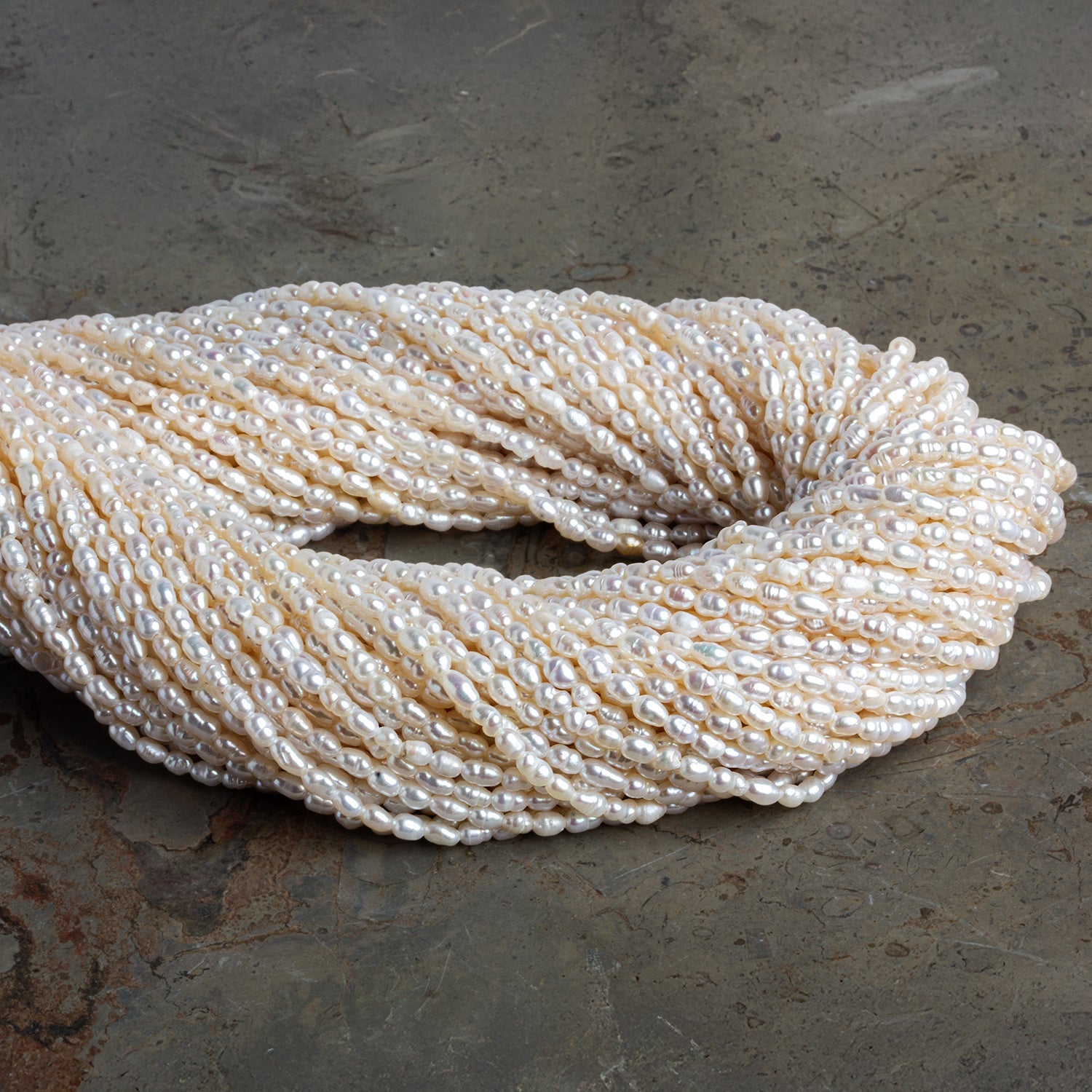 3x2mm Off White Baroque Rice Pearls 16 inch 95 beads - The Bead Traders