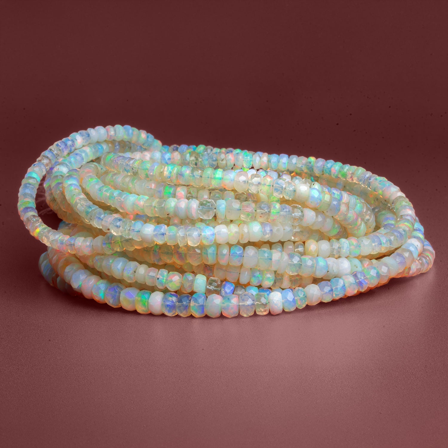 4 - 7mm Ethiopian Opal Faceted Rondelles 15 inch 145 beads - The Bead Traders