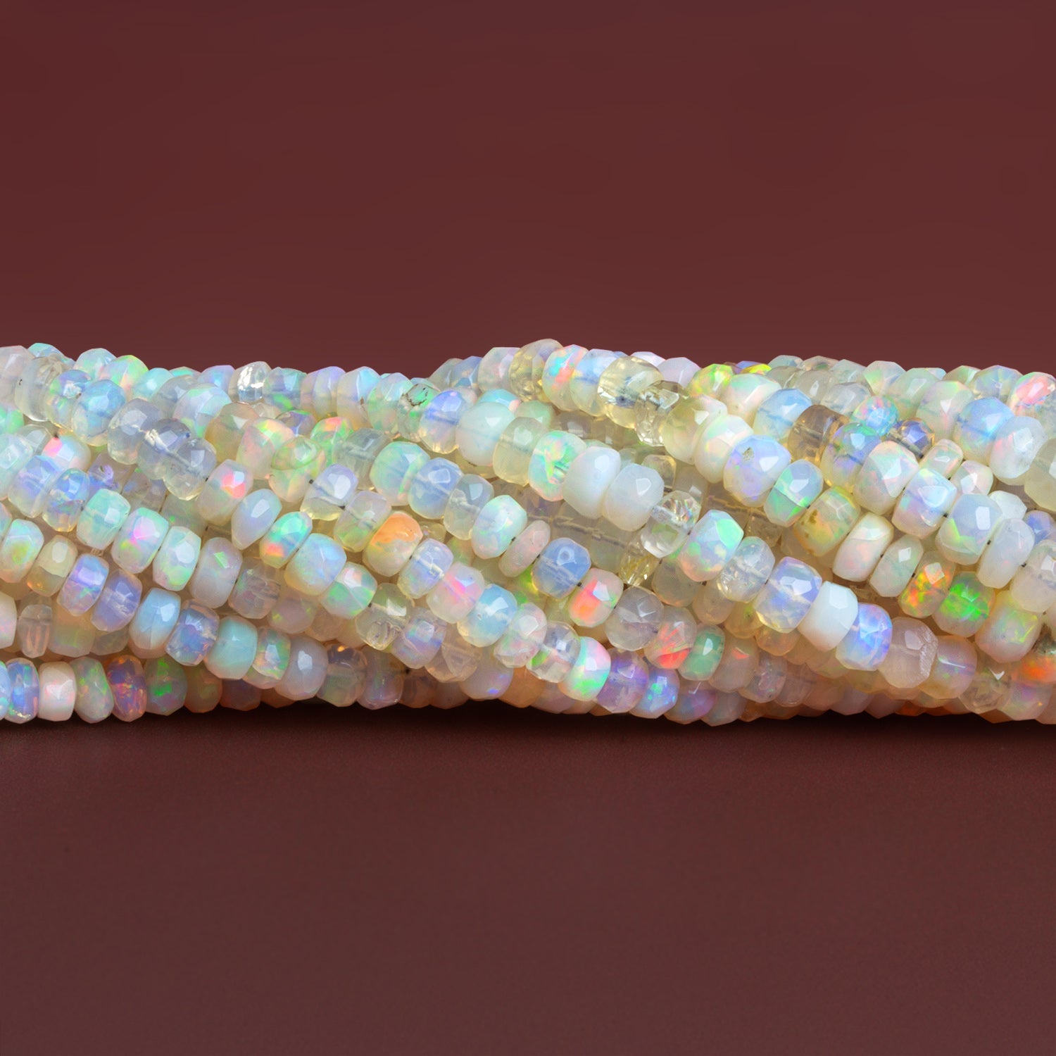 4 - 7mm Ethiopian Opal Faceted Rondelles 15 inch 145 beads - The Bead Traders