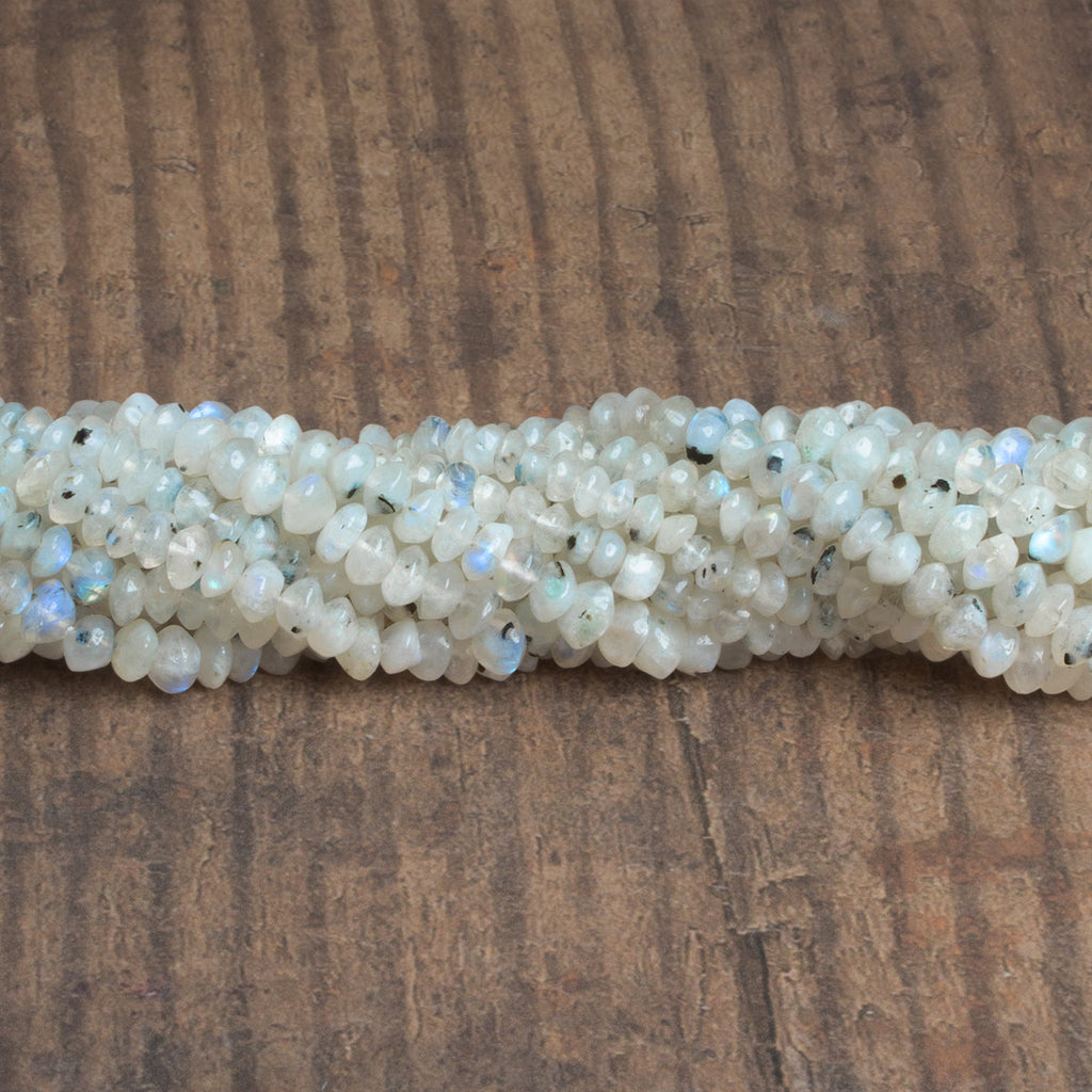 5-6mm Dalmatian Rainbow Moonstone Rondelles 12 inch 85 beads - The Bead Traders