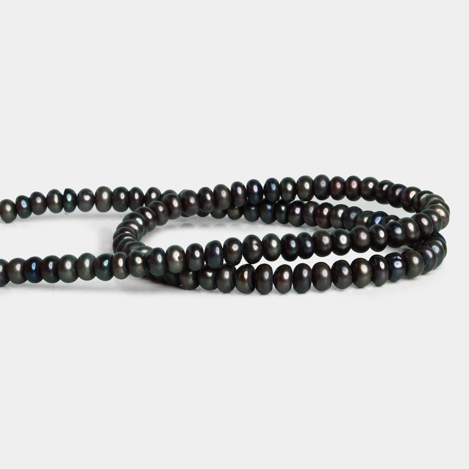5 - 6mm Eggplant Button Pearl 16 inch 80 beads - The Bead Traders