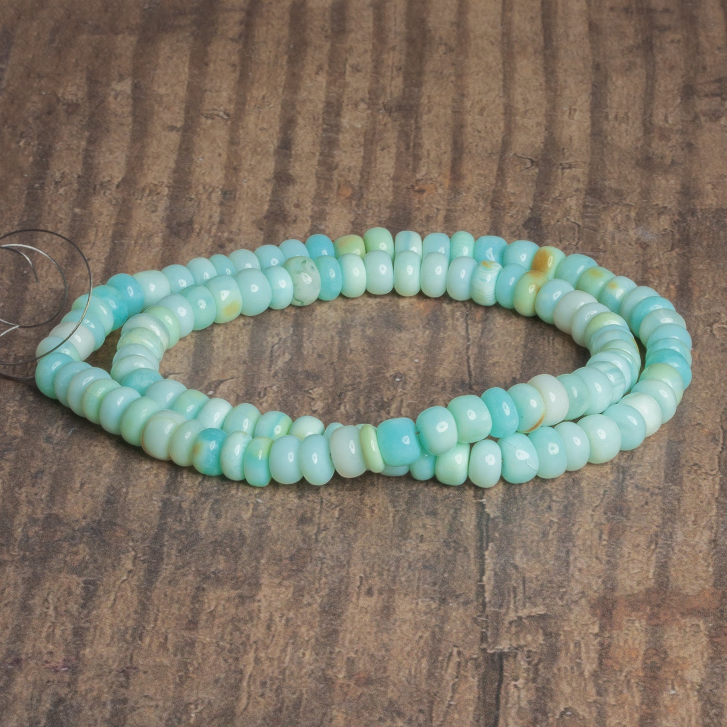 5-6mm Light Blue Opal Plain Rondelles 16 inch 95 beads - The Bead Traders