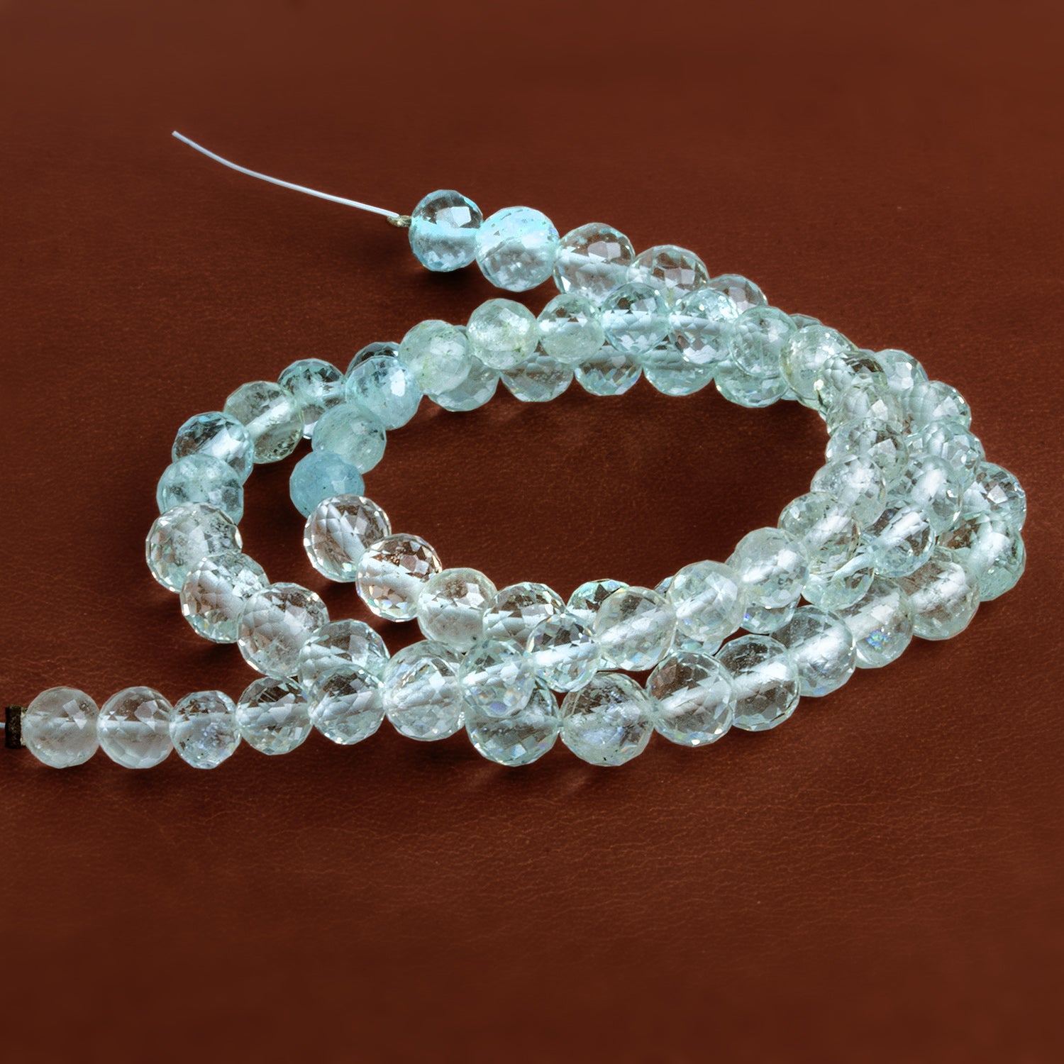 5-6mm Shaded Aquamarine Faceted Rounds 14 inch 72 beads - The Bead Traders