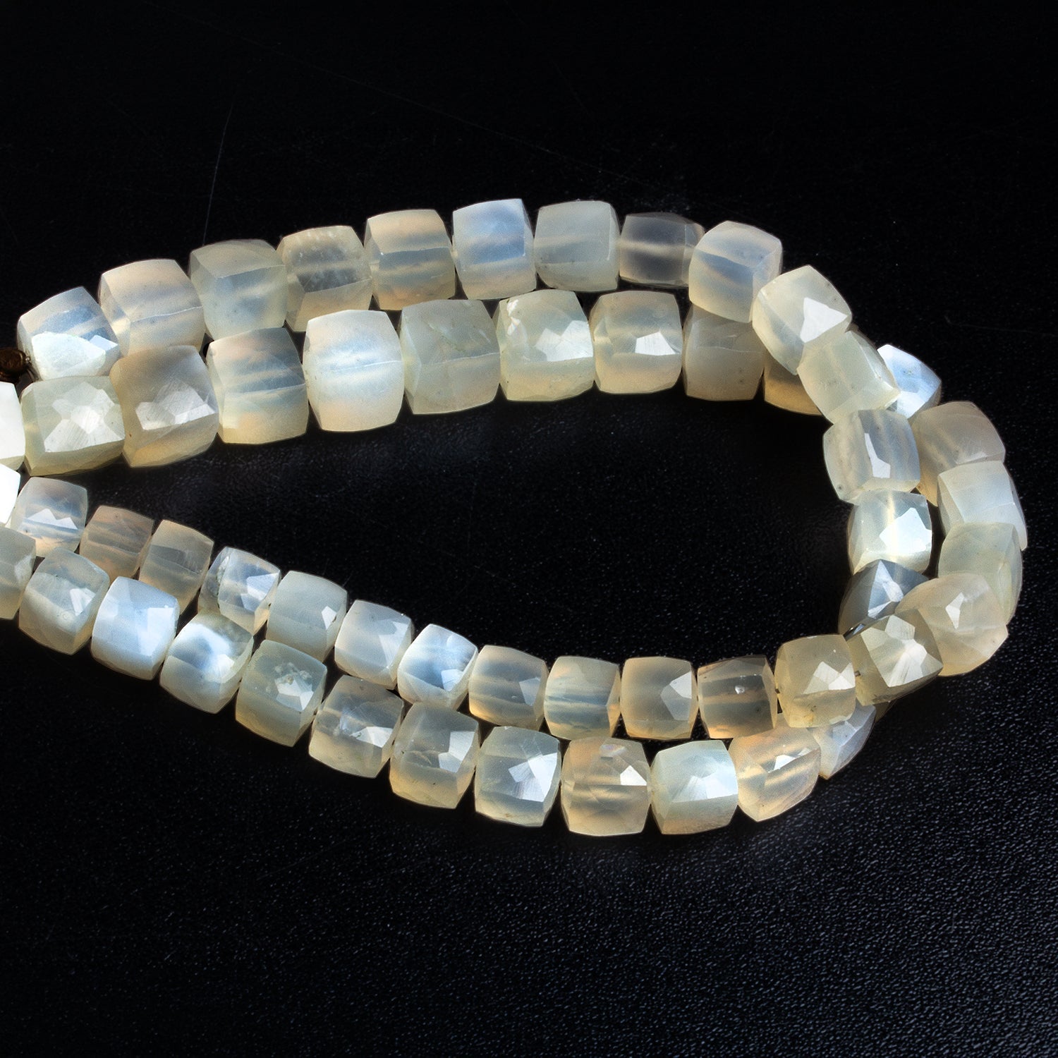 5 - 9mm White Moonstone Faceted Cubes 8.5 inch 29 beads - The Bead Traders