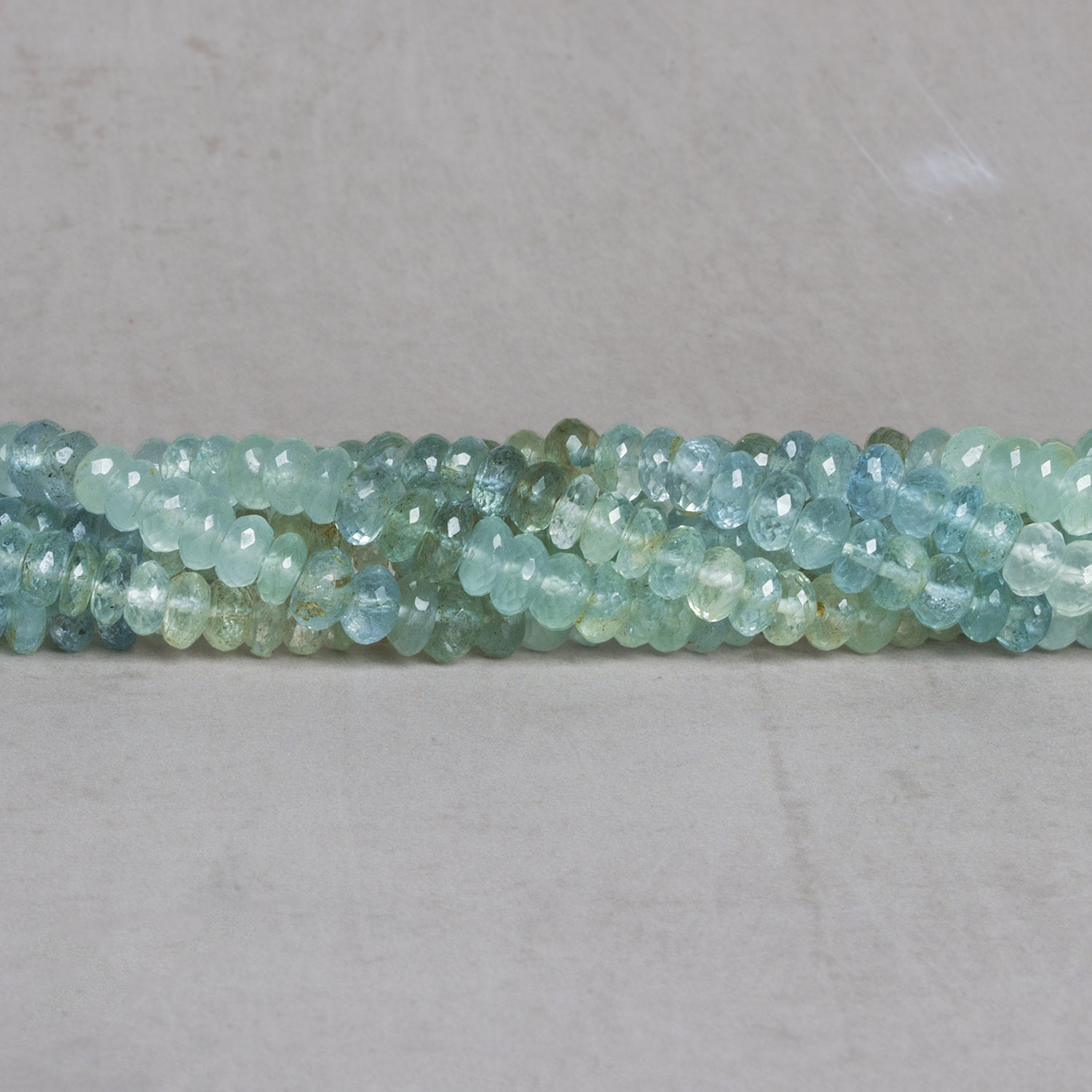 5mm Aquamarine Plain Rondelles 15 inch 110 beads - The Bead Traders