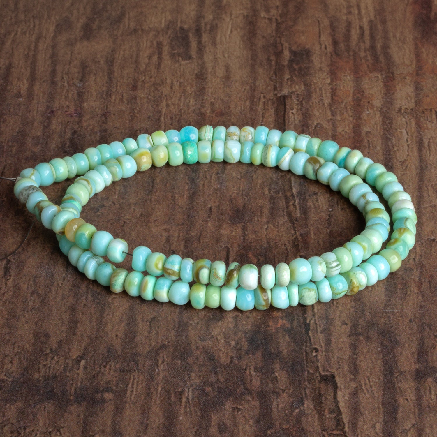 5mm Bue Opal Plain Rondelles 16 inch 110 beads - The Bead Traders