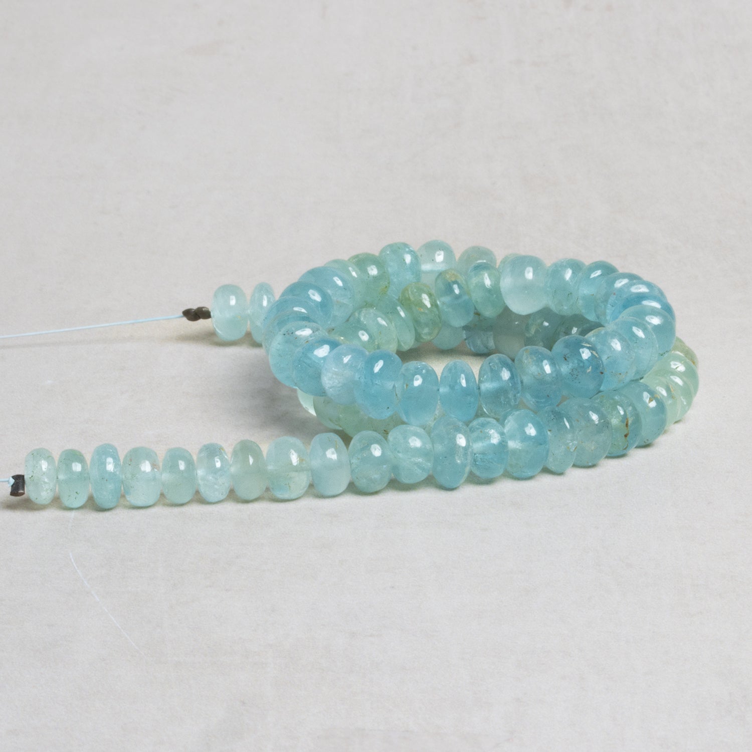 6 - 7mm Aquamarine Plain Rondelles 14 inch 83 beads - The Bead Traders