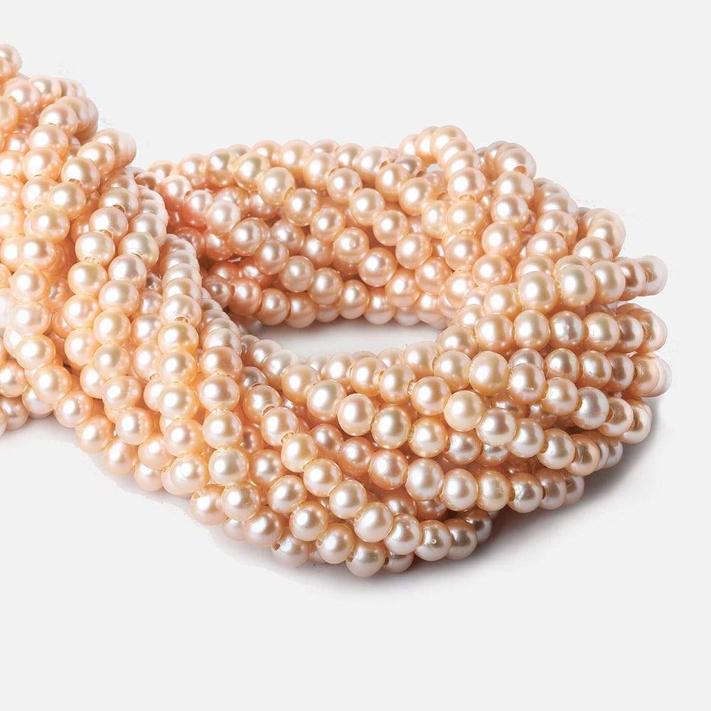 6 - 7mm Creamsicle Orange Large Hole Off Round Pearls 15 inch 75 beads - The Bead Traders