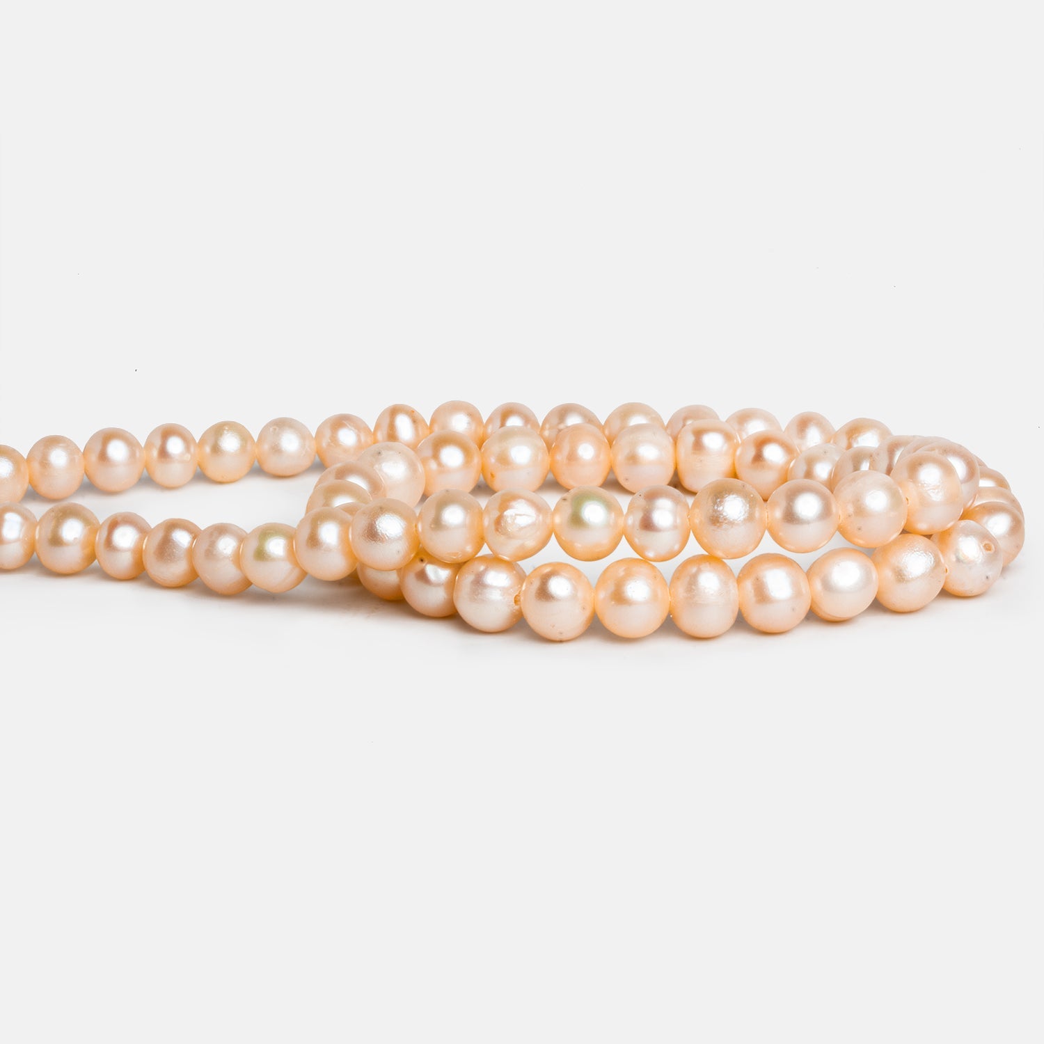 6 - 7mm Peach Off Round Pearls 15 inch 65 beads - The Bead Traders