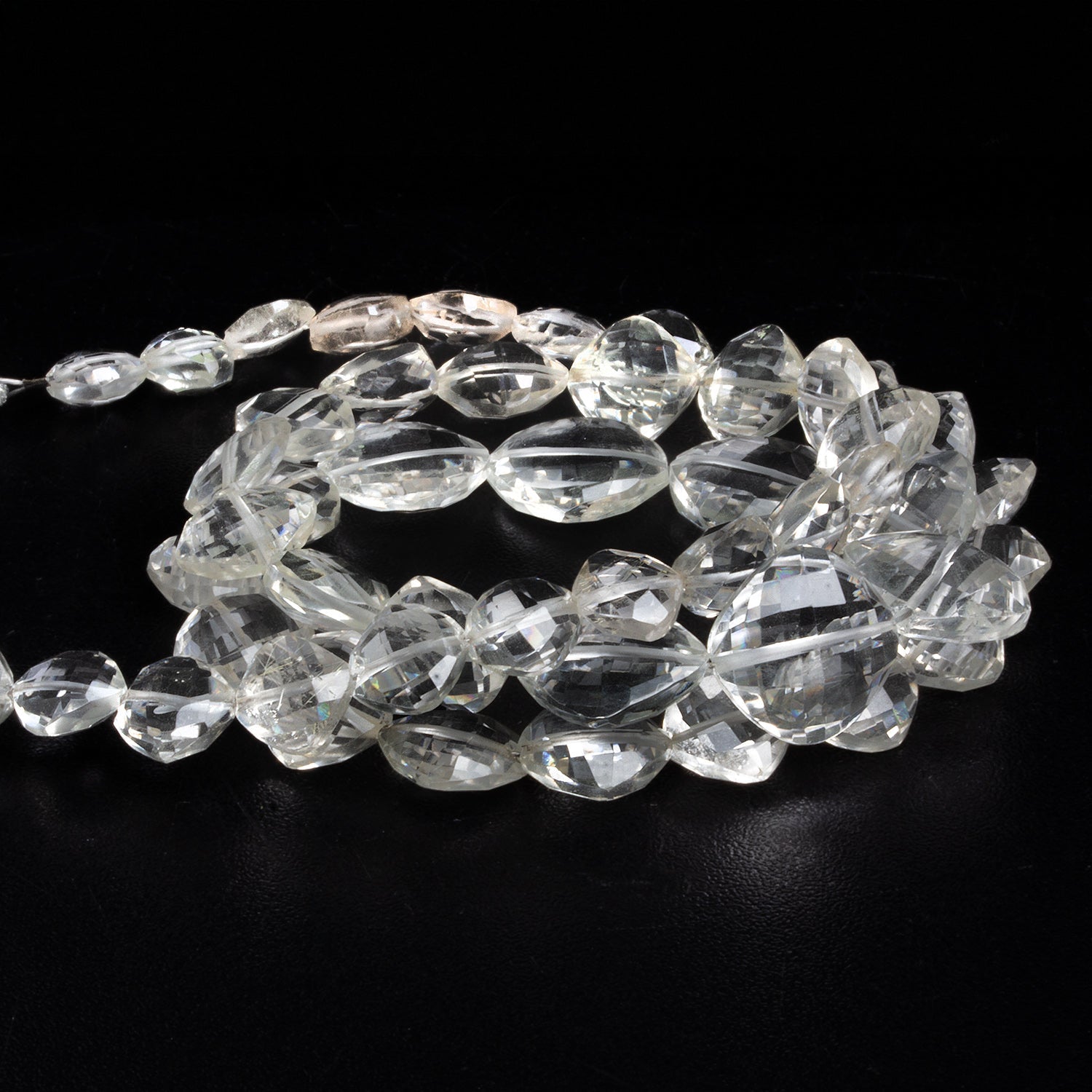 7 - 13mm Crystal Quartz Faceted Pillows 20 inch 50 beads - The Bead Traders