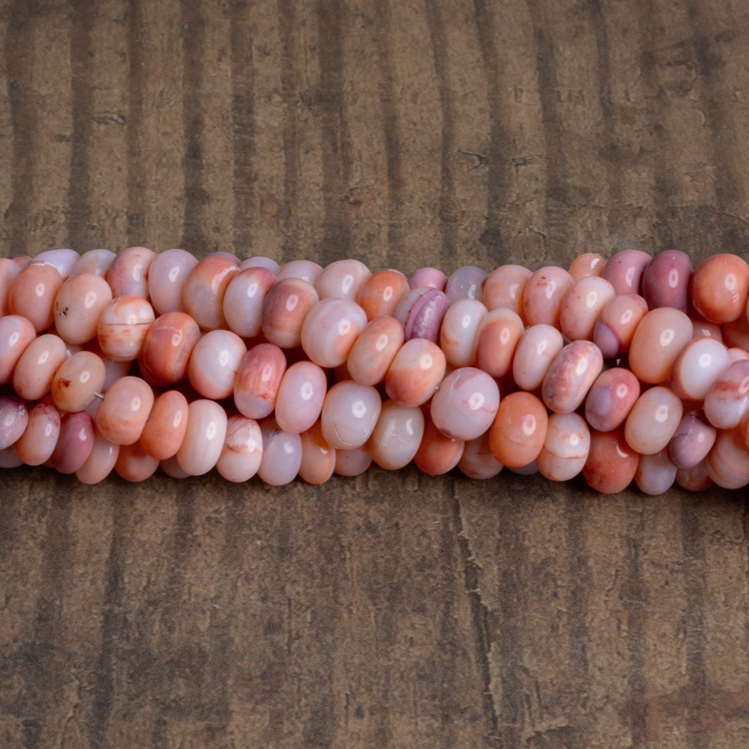 7 - 9mm Apricot Opal Plain Rondelles 16 inch 73 beads - The Bead Traders