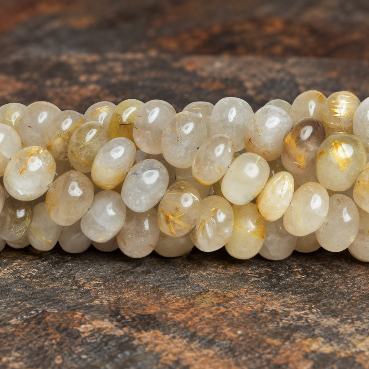 8-13mm Rutilated Quartz Plain Rondelles 16 inch 57 beads - The Bead Traders