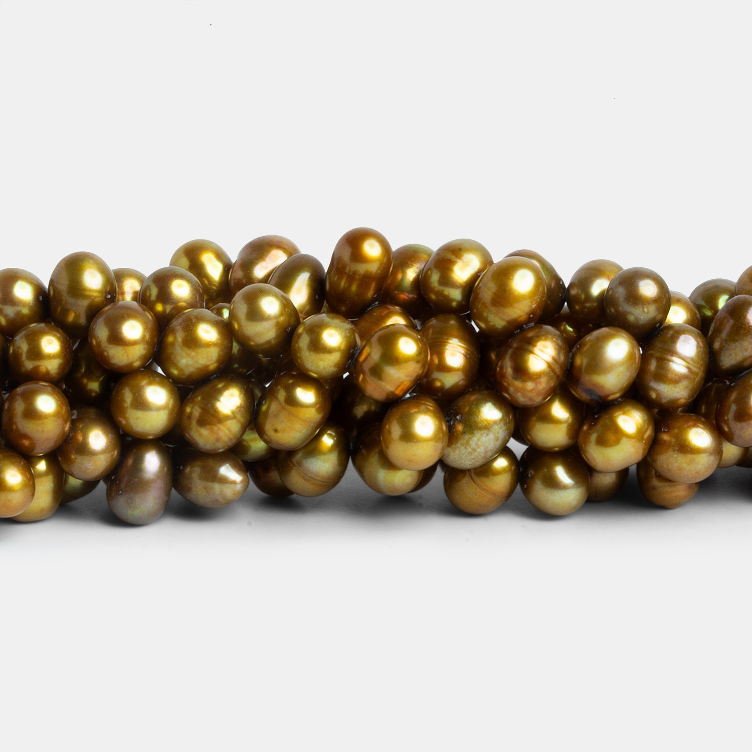 8x6mm Bronze Yellow Side Drilled Oval Pearls 16 inch 75 beads - The Bead Traders
