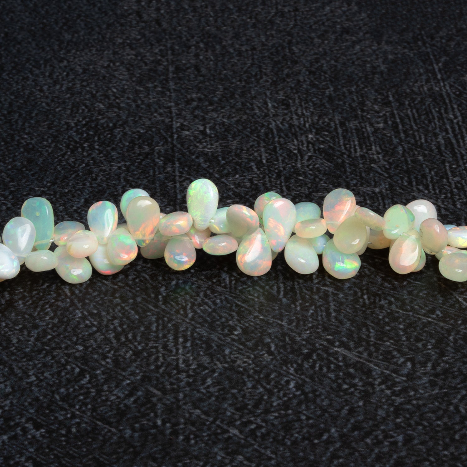 8x6mm Ethiopian Opal Plain Pears 9 inch 67 beads - The Bead Traders