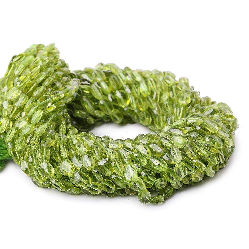 5x4-7x5mm Peridot faceted oval beads 13 inch 50 pieces - The Bead Traders