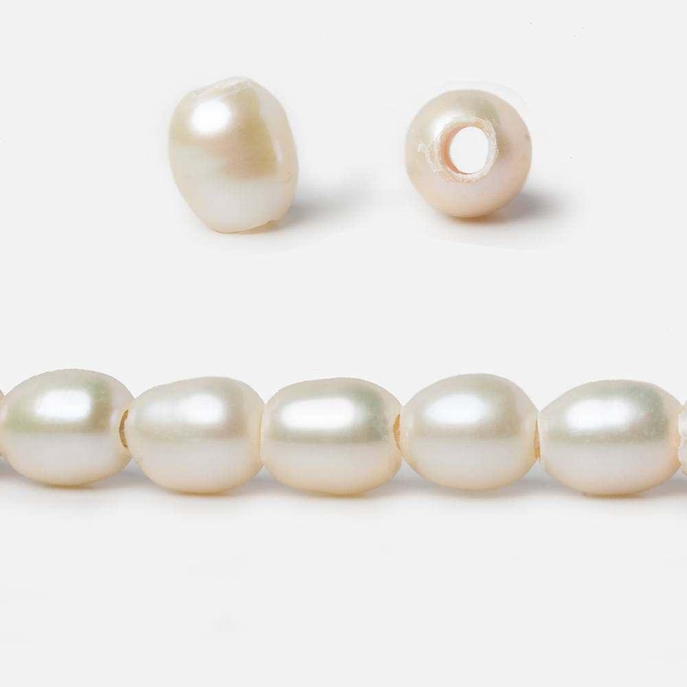 6.5x7mm Off White 2.5mm Large Hole Oval Freshwater Pearls 8 inch 27 pieces - The Bead Traders