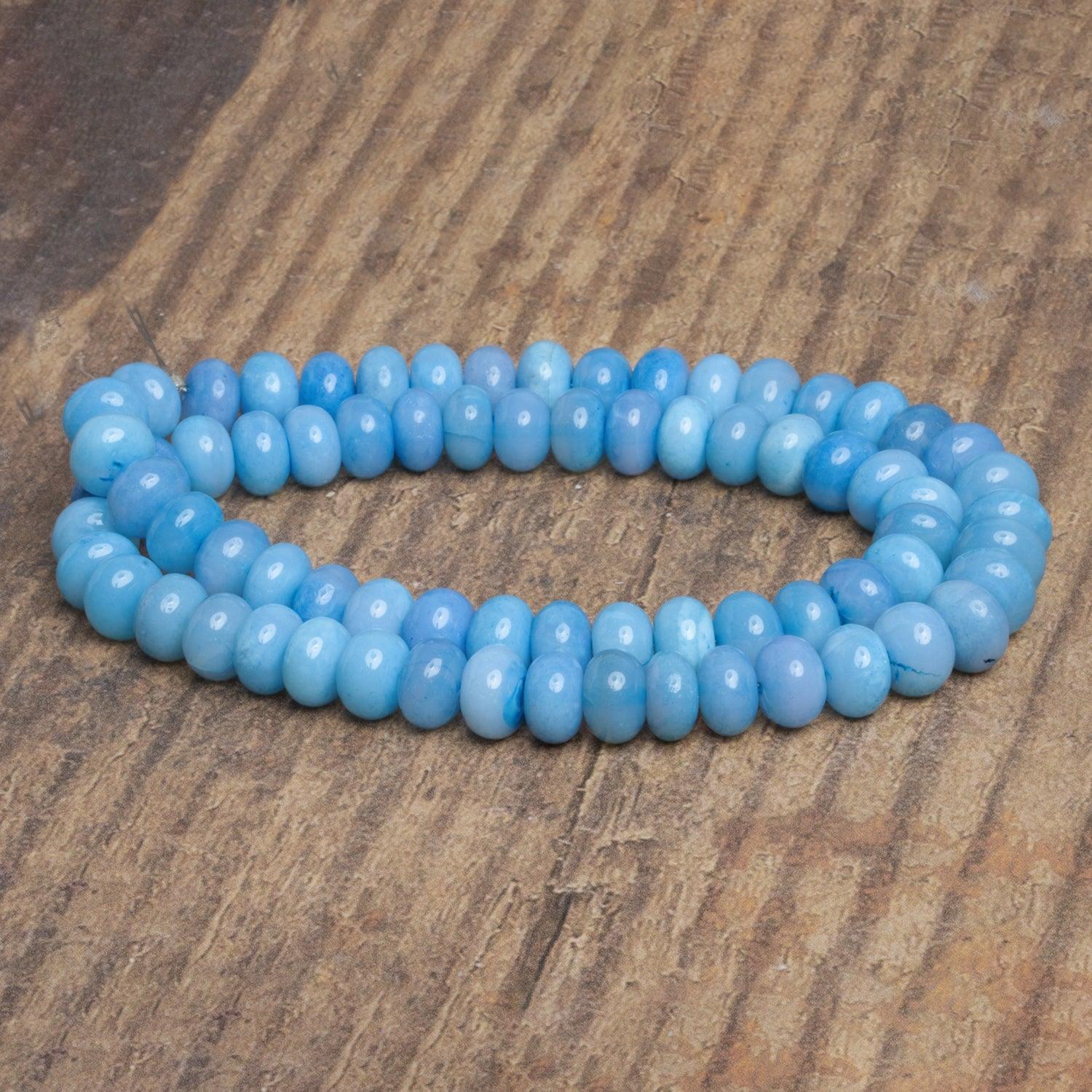 7-9mm Light Blue Opal Plain Rondelles 16 inch 65 beads - The Bead Traders