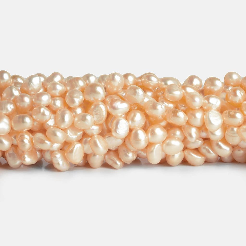 7x5mm Peach Baroque Pearls 15 inch 100 pieces - The Bead Traders