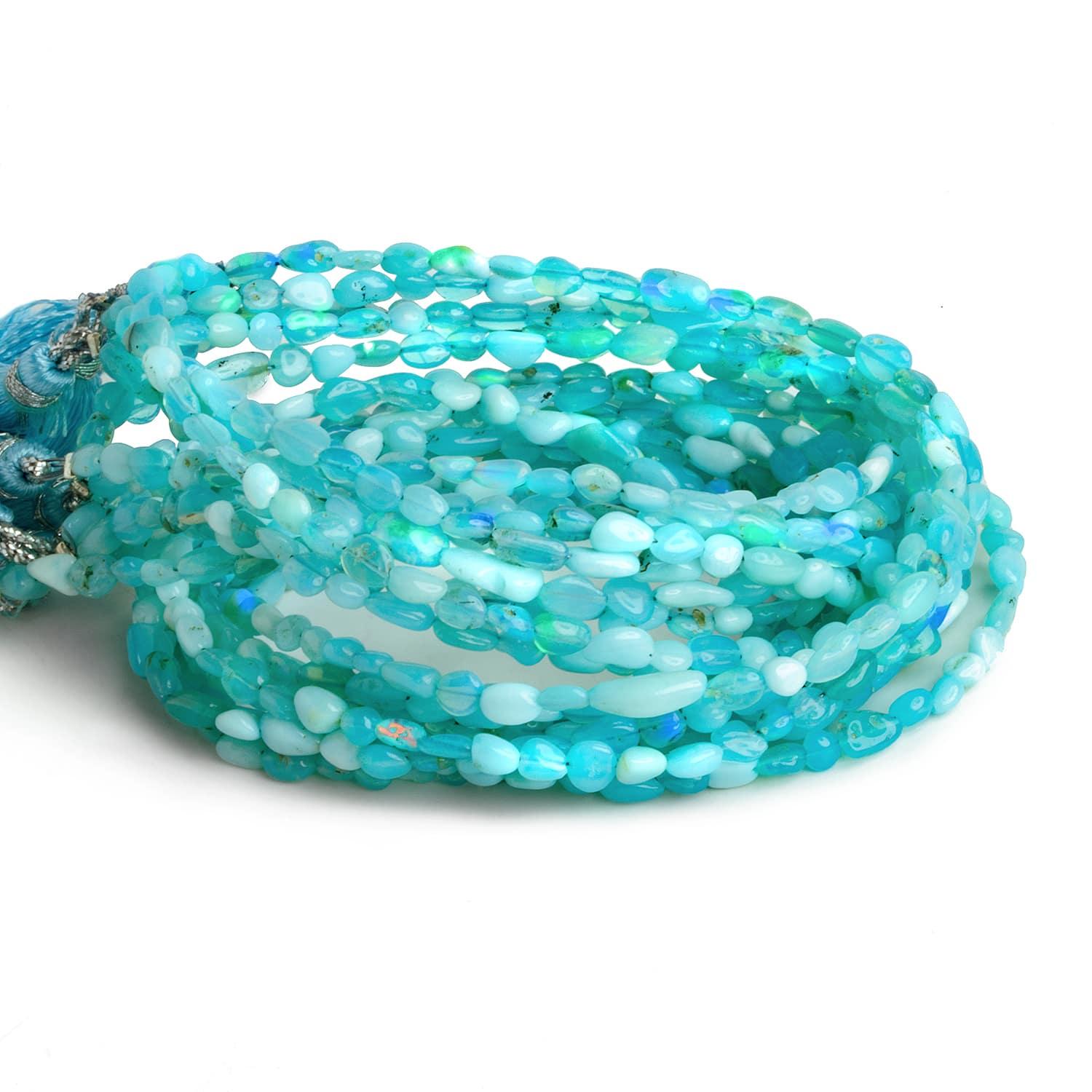 Blue Ethiopian Opal Plain Nuggets 15 inch 55 beads - The Bead Traders