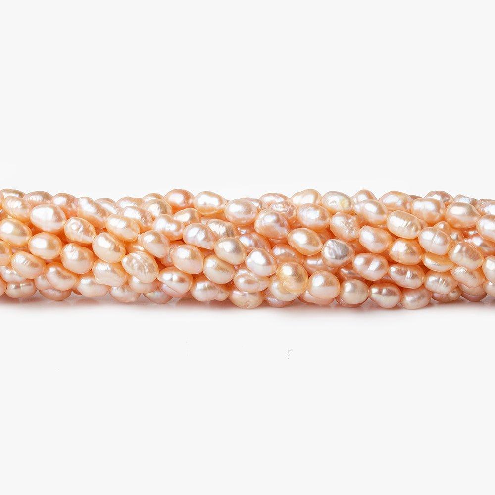 Peach Petite Baroque Freshwater Pearl 16 inch 50 pieces 5x4mm - 7x4mm - The Bead Traders