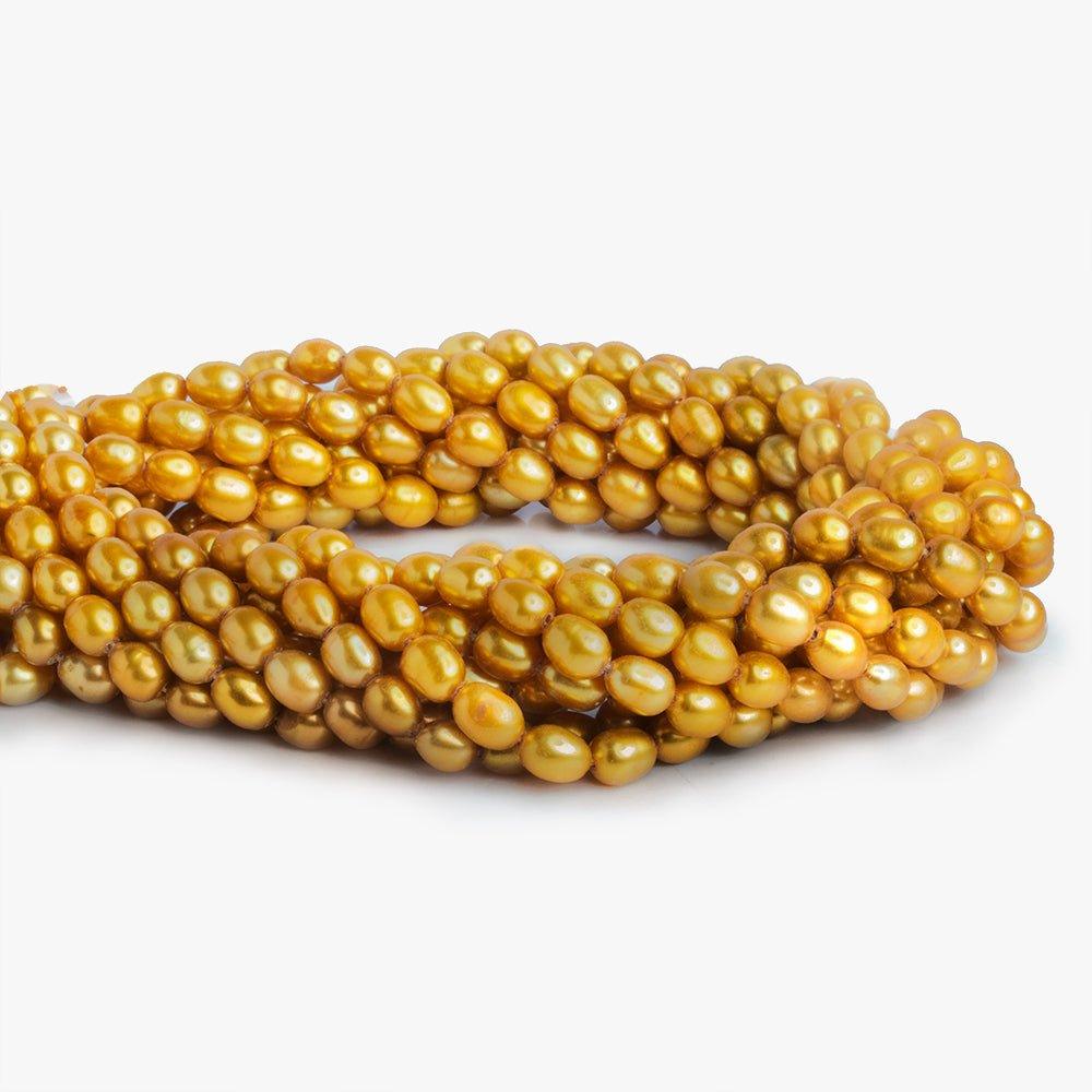 Saffron Yellow Straight Drilled Oval Freshwater Pearl 15.5" length, 6x5mm average, 67 pcs - The Bead Traders