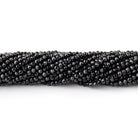 black microfaceted round beads