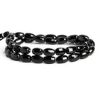 11x7mm Black Spinel Checkerboard Faceted Barrels 16 inch 37 beads - The Bead Traders