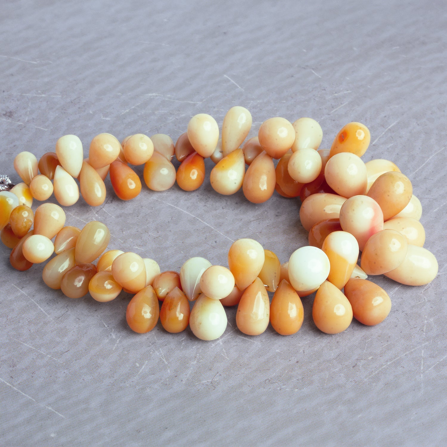 11x7mm Orange Opal Plain Teardrops 7.5 inch 67 beads - The Bead Traders