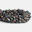 12x9mm Steel Peacock Keshi Pearls 15 inch 32 beads - The Bead Traders