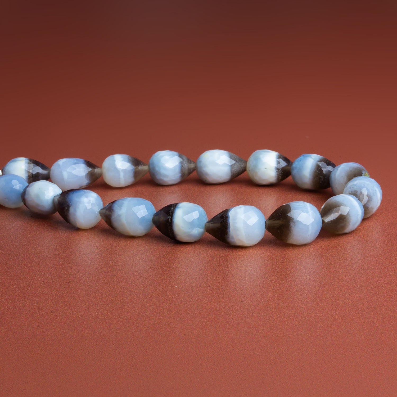 13x9mm Banded Denim Opal Faceted Teardrops 8 inch 17 beads - The Bead Traders