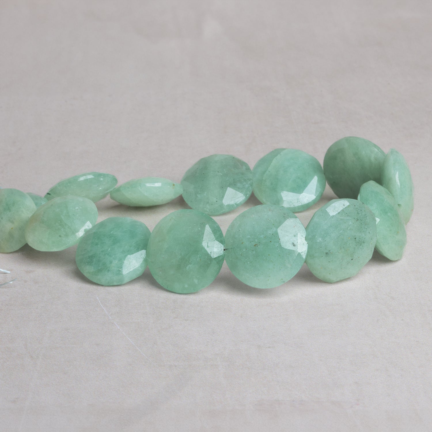 14 - 17mm Aquamarine Faceted Coins 8 inch 14 beads - The Bead Traders