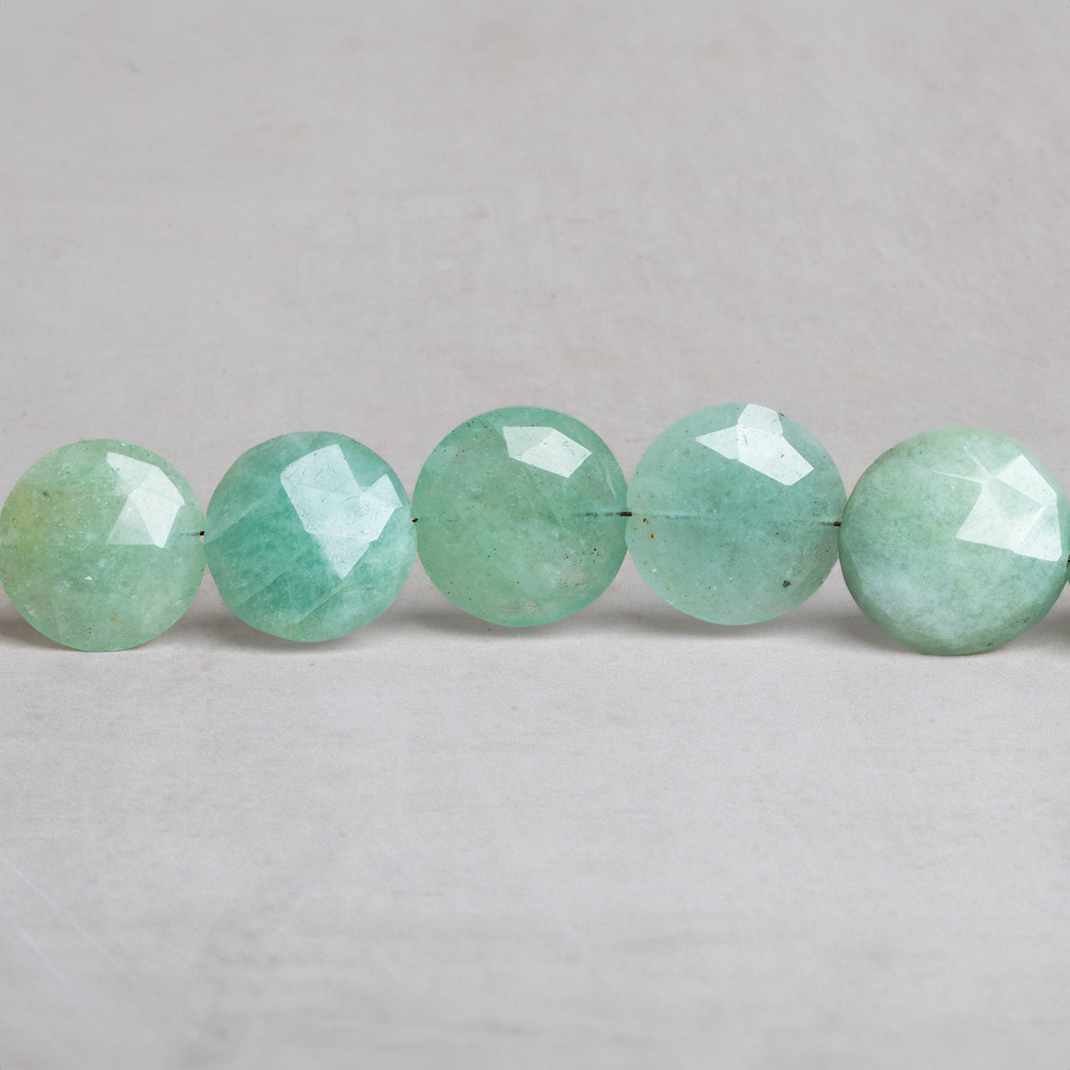 14 - 17mm Aquamarine Faceted Coins 8 inch 14 beads - The Bead Traders