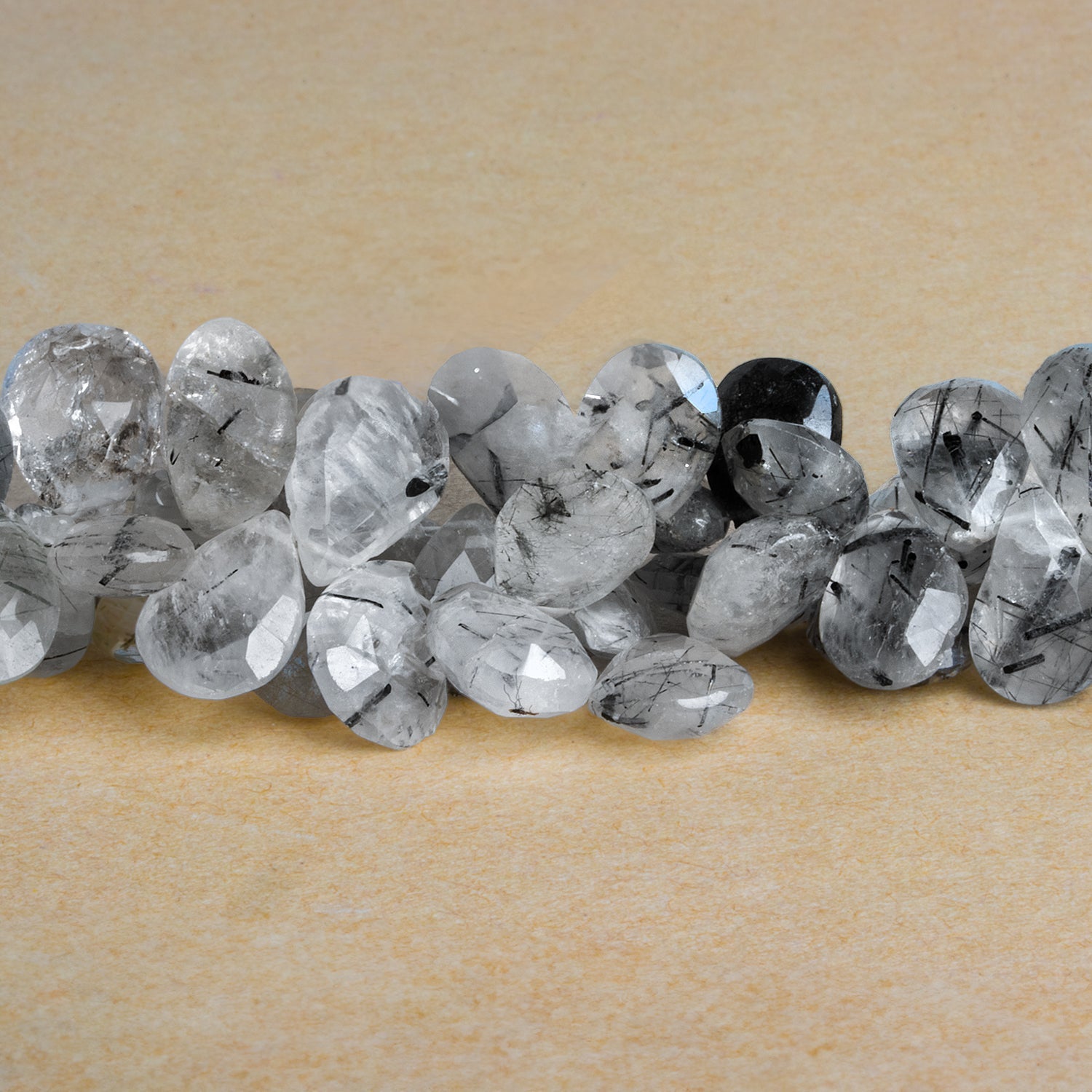 14x10mm Tourmalinated Quartz Faceted Pears 8 inch 40 beads - The Bead Traders