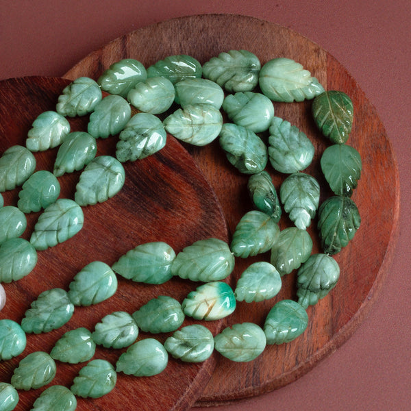 15x9mm Emerald Carved Pears 16 inch 31 beads