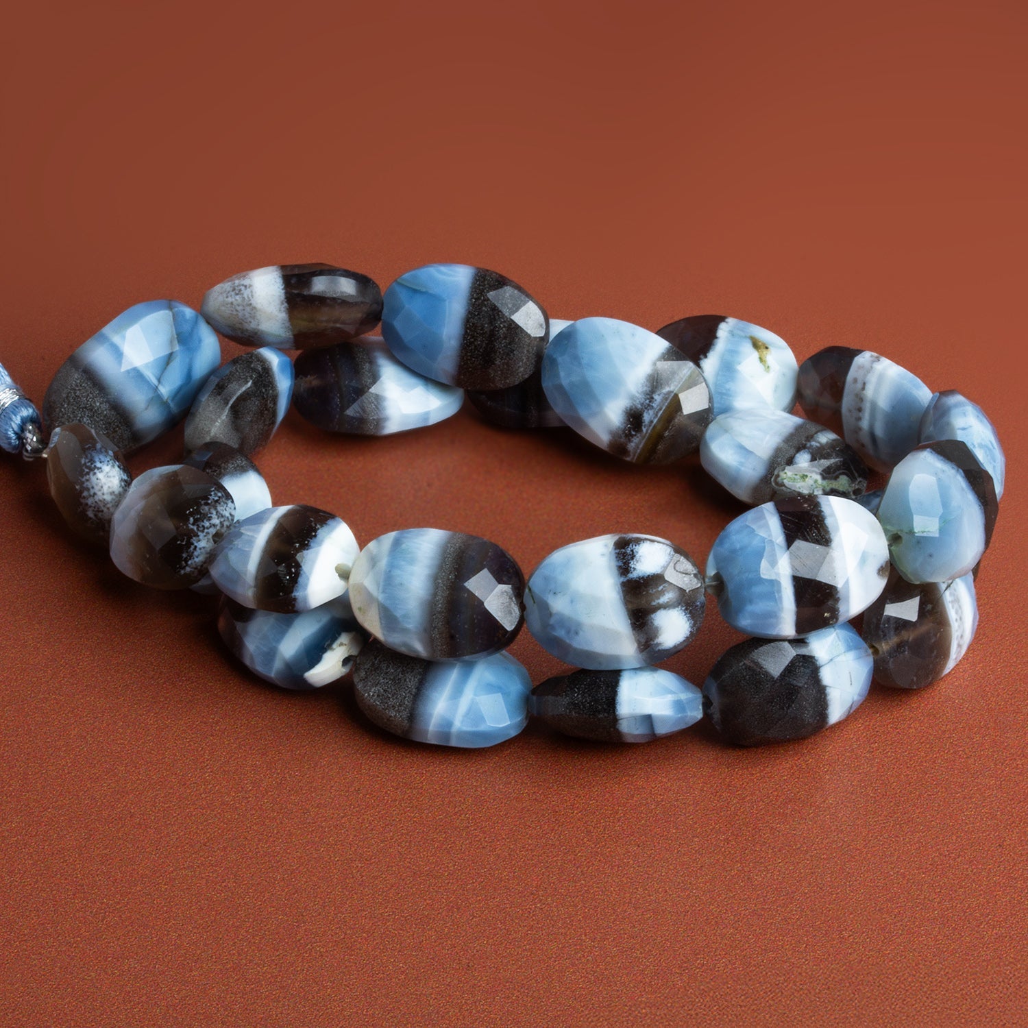 17x12mm Denim Opal Faceted Ovals 15 inch 25 beads - The Bead Traders