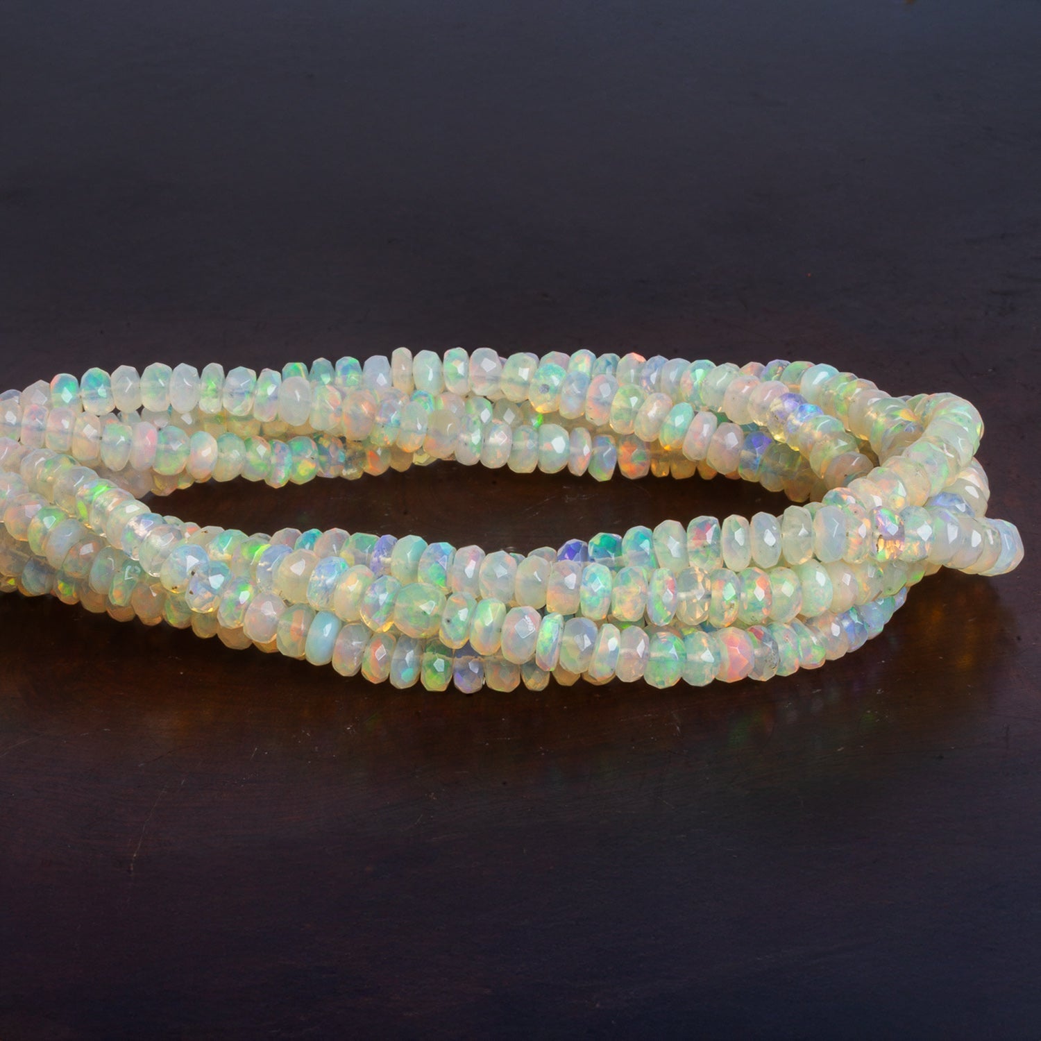 3.5 - 5mm Ethiopian Opal Faceted Rondelles 17 inch 165 beads - The Bead Traders