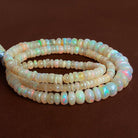 4-6.5mm Ethiopian Opal Plain Rondelles 16 inch 160 beads - The Bead Traders