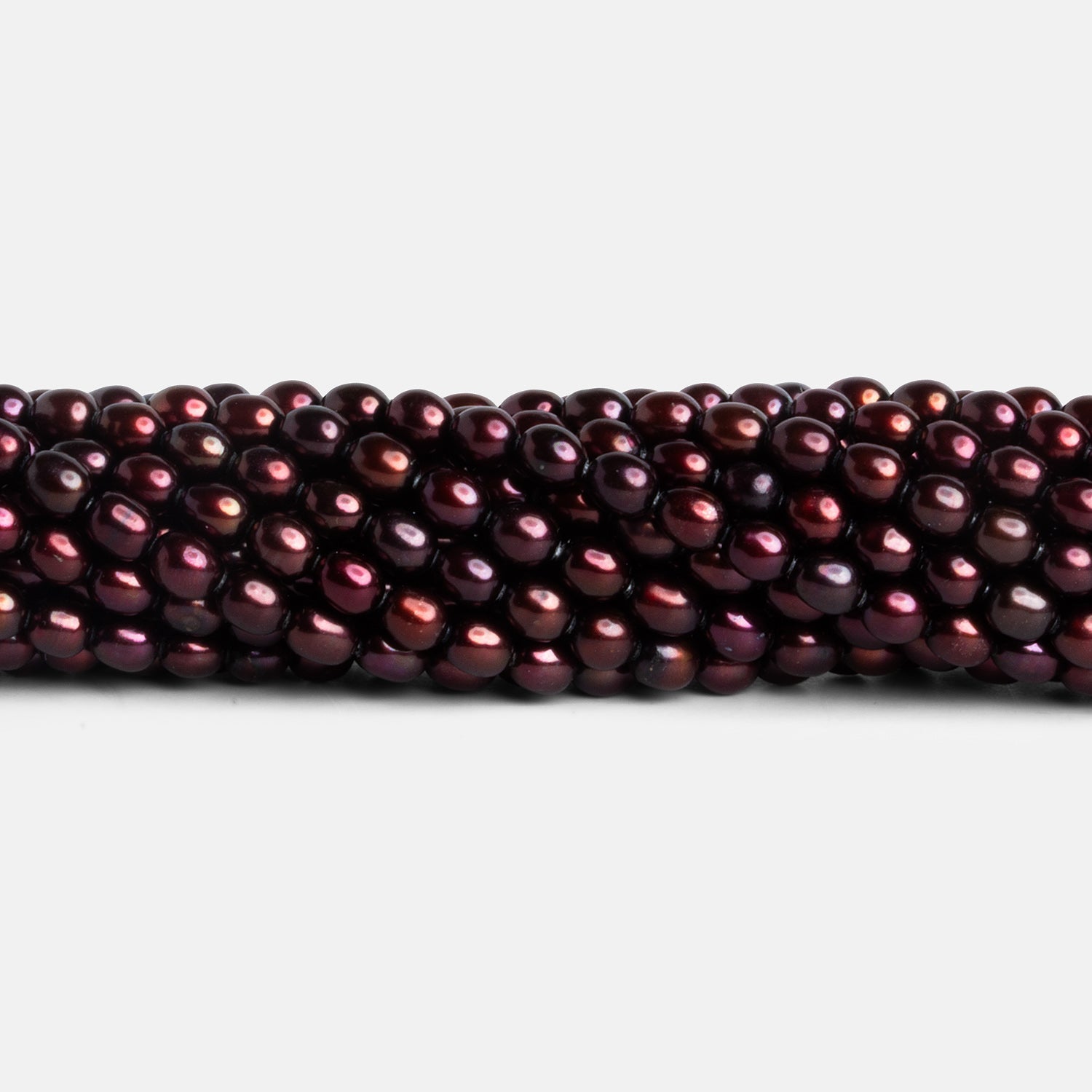 4.5x3.5mm Burgundy Straight Drilled Oval Pearls 16 inch 93 beads - The Bead Traders