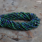4mm Chrysocolla in Lapis Lazuli Plan Rounds 15 inch 100 beads - The Bead Traders