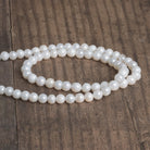 5-6.5mm Mystic Quartz Plain Rounds 16 inch 63 beads - The Bead Traders
