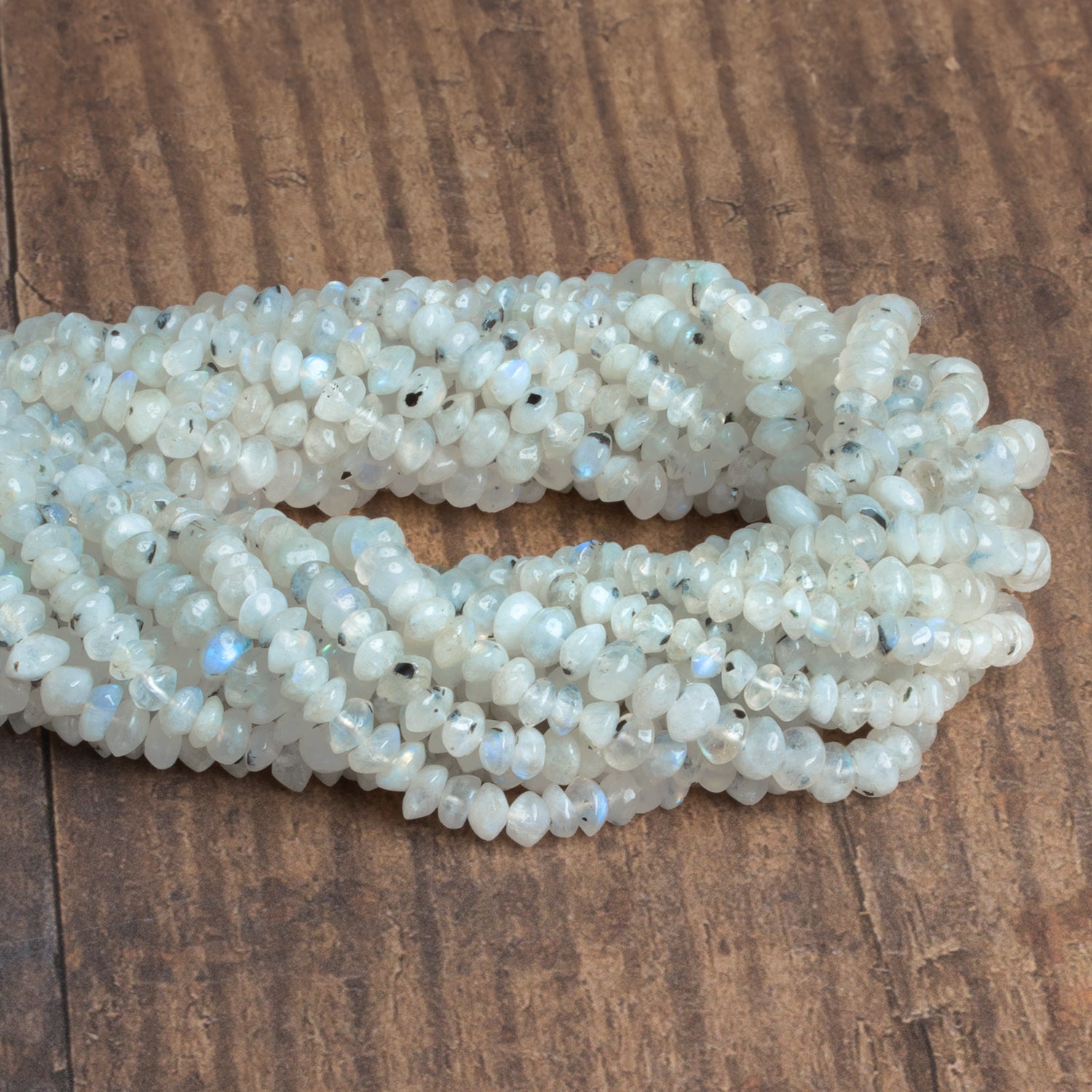 5-6mm Dalmatian Rainbow Moonstone Rondelles 12 inch 85 beads - The Bead Traders