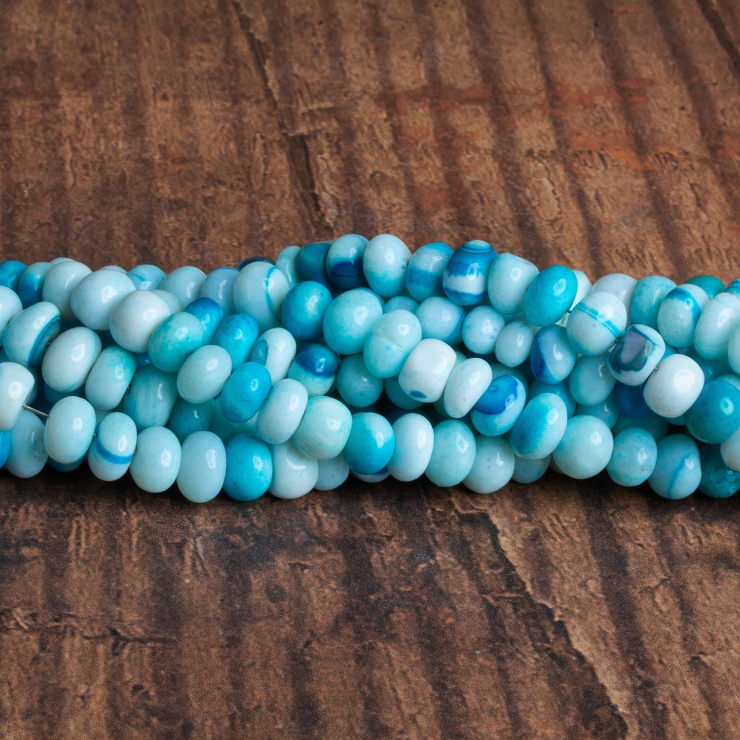 5 - 7mm Blue Opal Plain Rondelles 16 inch 80 beads - The Bead Traders