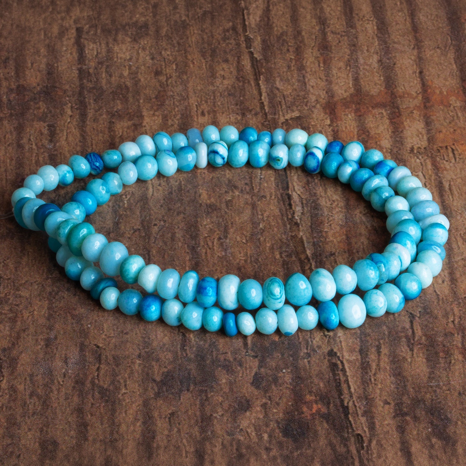 5 - 7mm Blue Opal Plain Rondelles 16 inch 80 beads - The Bead Traders