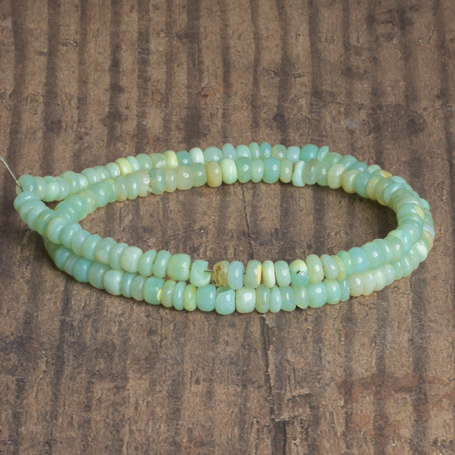 5.5mm Light Sea Green Opal Plain Rondelles 16 inch 125 beads - The Bead Traders