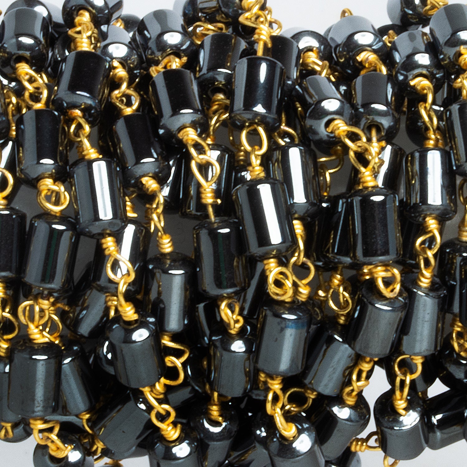 5x4mm Hematite Plain Tube Gold Chain 28 beads - The Bead Traders